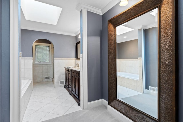 bathroom featuring tile patterned floors, visible vents, vanity, and crown molding