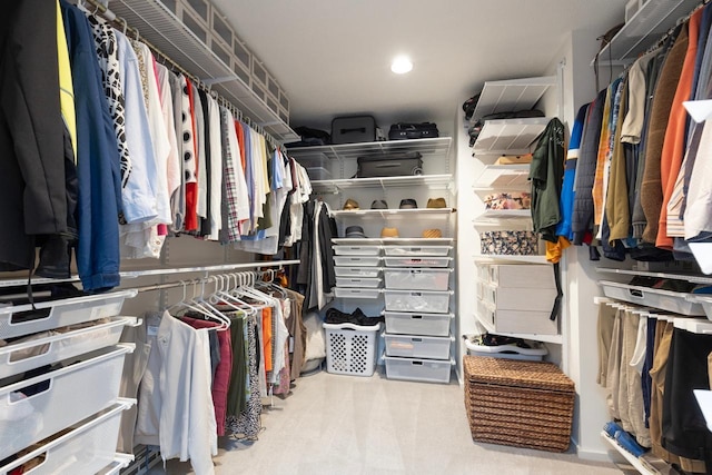 walk in closet featuring carpet