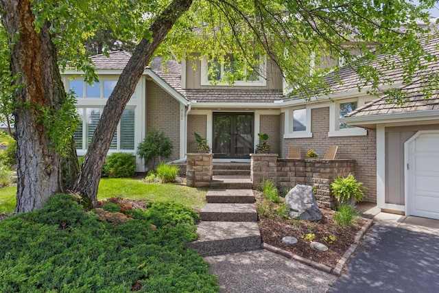 entrance to property featuring brick siding