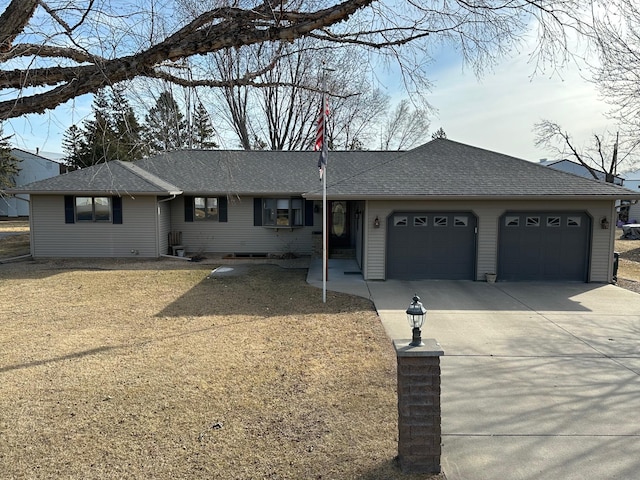 ranch-style home featuring an attached garage, driveway, and roof with shingles