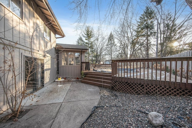 exterior space featuring a deck and a patio