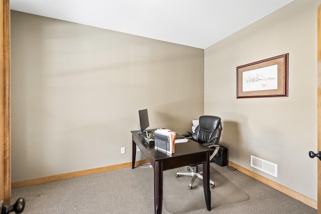 office area featuring baseboards, visible vents, and carpet floors