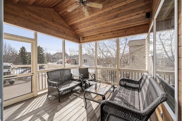 sunroom with ceiling fan, wood ceiling, and lofted ceiling