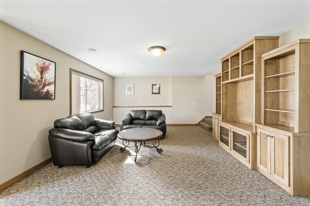 living room with stairway, baseboards, and carpet