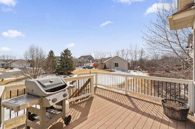 wooden deck featuring a residential view and grilling area