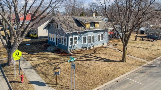 view of front of property with roof with shingles