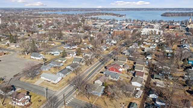 drone / aerial view featuring a water view and a residential view