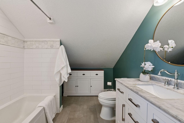 full bath with shower / washtub combination, toilet, vanity, vaulted ceiling, and a textured ceiling