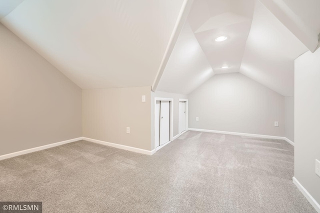 bonus room featuring recessed lighting, baseboards, carpet, and lofted ceiling