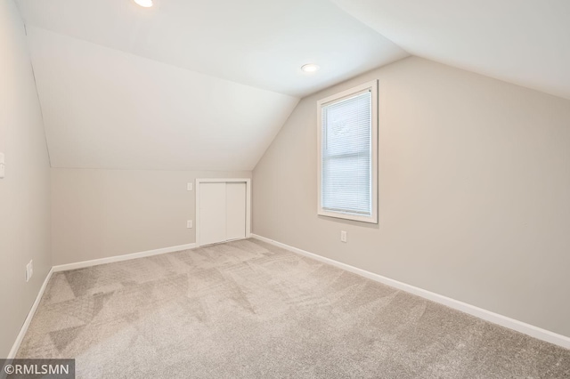 bonus room featuring vaulted ceiling, recessed lighting, baseboards, and carpet floors