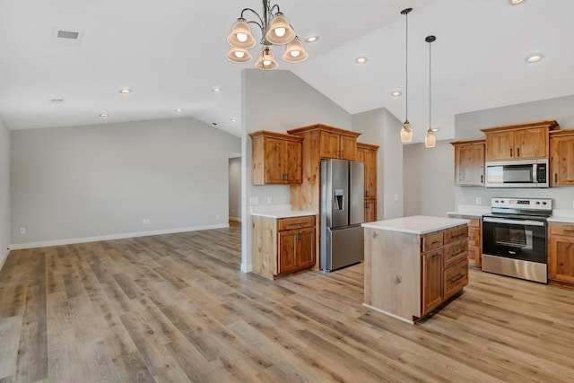 kitchen featuring light countertops, visible vents, appliances with stainless steel finishes, and brown cabinets