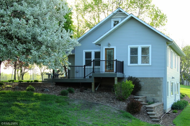 5501 70th St, Glencoe, MN 55336 - back of property with a deck and a lawn