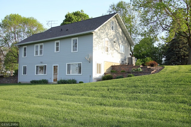 5501 70th St, Glencoe, MN 55336 - rear view of house with a lawn and cooling unit