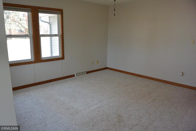 5501 70th St, Glencoe, MN 55336 - empty room featuring carpet floors and baseboards