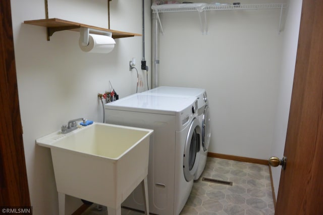5501 70th St, Glencoe, MN 55336 - laundry room with washing machine and dryer and baseboards