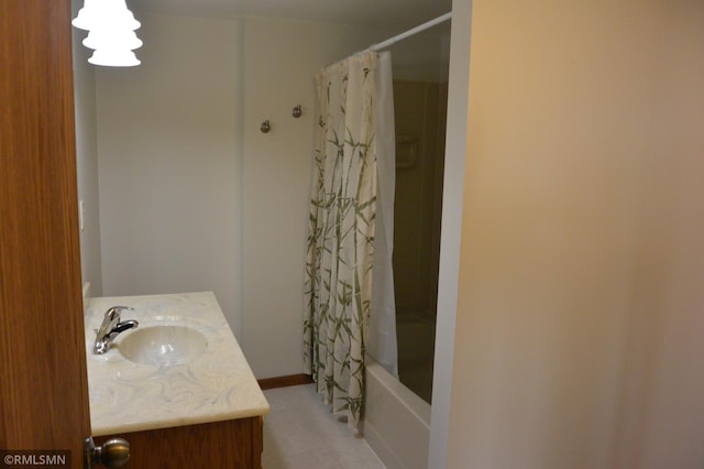 5501 70th St, Glencoe, MN 55336 - bathroom with vanity, shower / bath combo with shower curtain, and baseboards