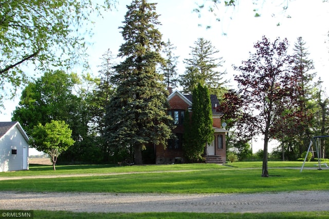 5501 70th St, Glencoe, MN 55336 - view of side of home featuring a lawn