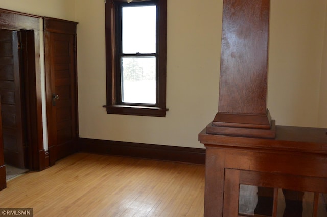 5501 70th St, Glencoe, MN 55336 - unfurnished bedroom featuring wood finished floors and baseboards