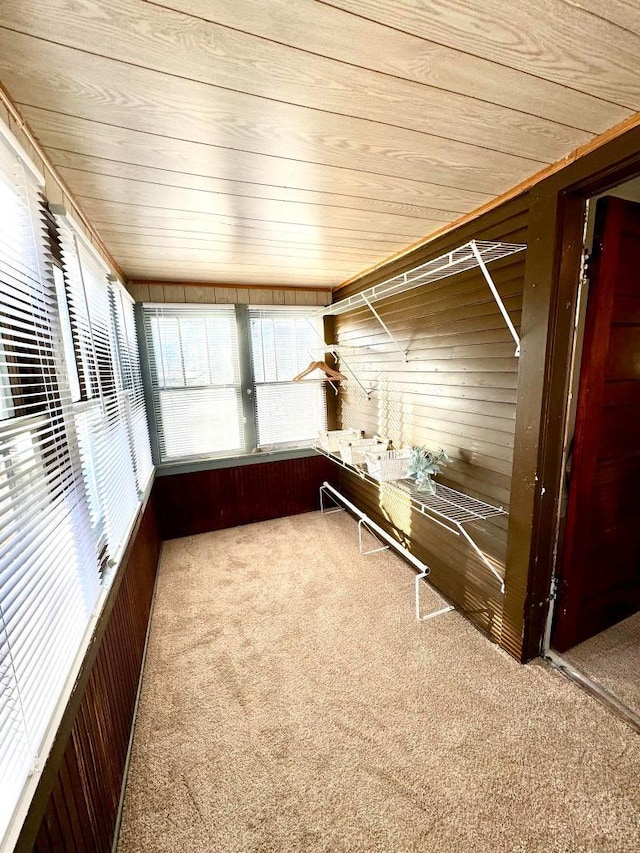 unfurnished sunroom featuring wood ceiling