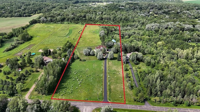 birds eye view of property featuring a rural view