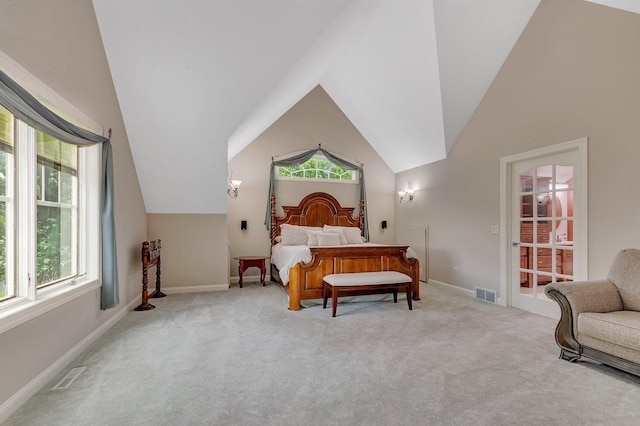 bedroom with light carpet, visible vents, and multiple windows