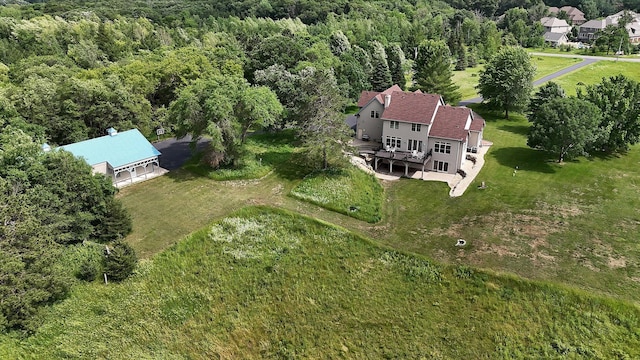 bird's eye view featuring a wooded view