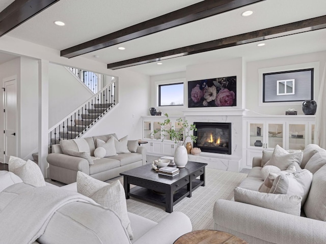 16419 Kiska St NE, Ham Lake, MN 55304 - living area featuring recessed lighting, beam ceiling, stairs, and a fireplace