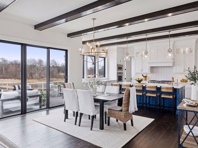 16419 Kiska St NE, Ham Lake, MN 55304 - dining area with dark wood-type flooring, a chandelier, and beam ceiling