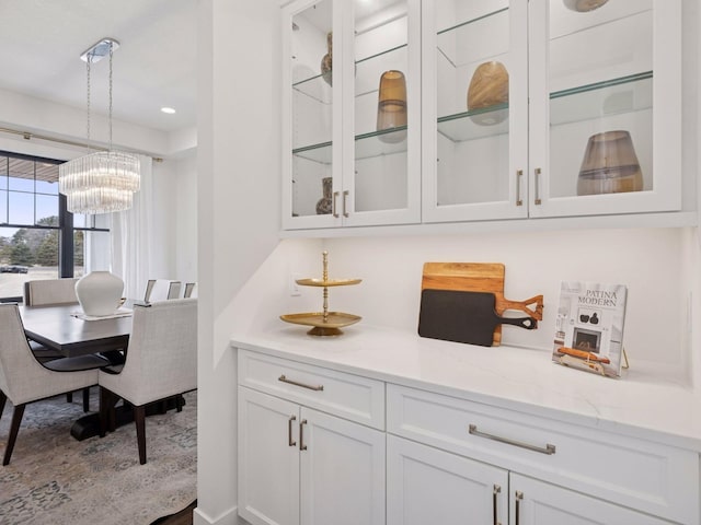 16419 Kiska St NE, Ham Lake, MN 55304 - bar area featuring a chandelier, pendant lighting, and recessed lighting