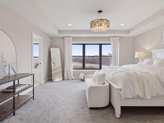 16419 Kiska St NE, Ham Lake, MN 55304 - carpeted bedroom with a chandelier, recessed lighting, and a tray ceiling