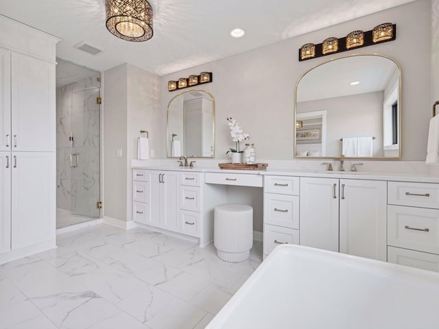 16419 Kiska St NE, Ham Lake, MN 55304 - bathroom with a marble finish shower, marble look tile flooring, a freestanding bath, vanity, and recessed lighting