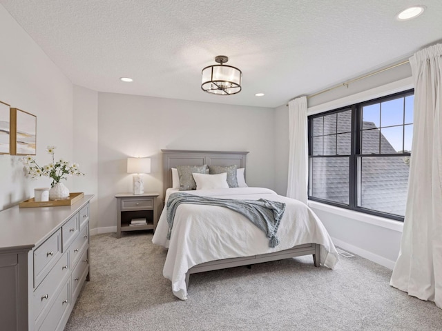 16419 Kiska St NE, Ham Lake, MN 55304 - bedroom with light colored carpet, recessed lighting, and a textured ceiling