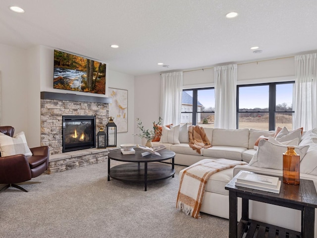 16419 Kiska St NE, Ham Lake, MN 55304 - living area featuring recessed lighting, carpet, and a fireplace