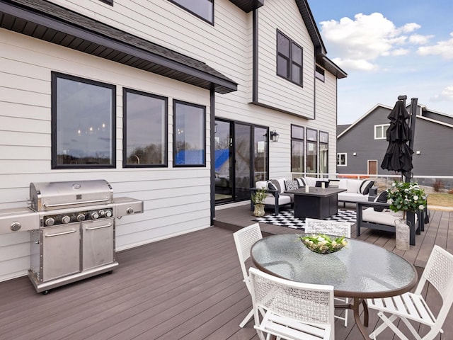 16419 Kiska St NE, Ham Lake, MN 55304 - wooden deck with outdoor lounge area and grilling area