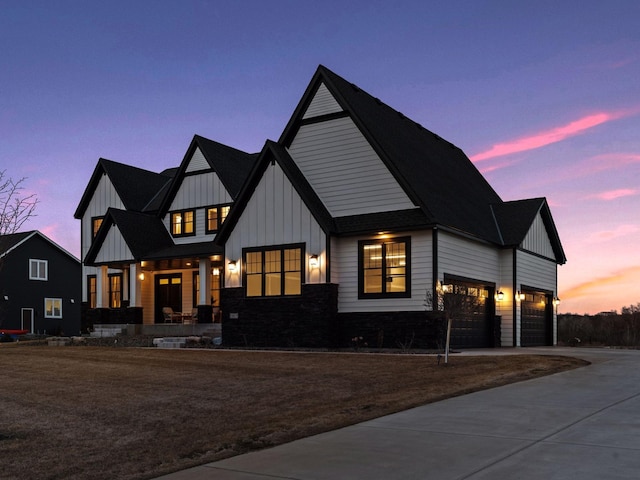 16419 Kiska St NE, Ham Lake, MN 55304 - modern inspired farmhouse with board and batten siding, covered porch, concrete driveway, and a garage