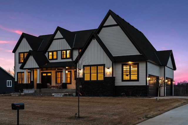 16419 Kiska St NE, Ham Lake, MN 55304 - modern inspired farmhouse featuring covered porch, board and batten siding, concrete driveway, stone siding, and an attached garage
