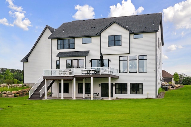 16419 Kiska St NE, Ham Lake, MN 55304 - rear view of property with a patio, a deck, a yard, stairs, and a shingled roof