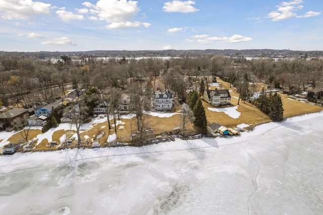 snowy aerial view featuring a residential view