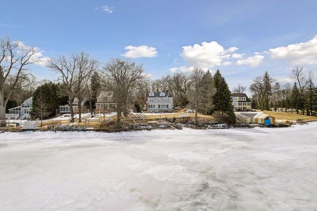 view of yard layered in snow