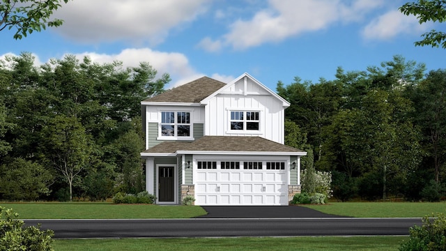 view of front facade with a front yard, board and batten siding, stone siding, and aphalt driveway