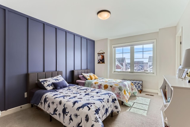 bedroom featuring visible vents, baseboards, and carpet floors