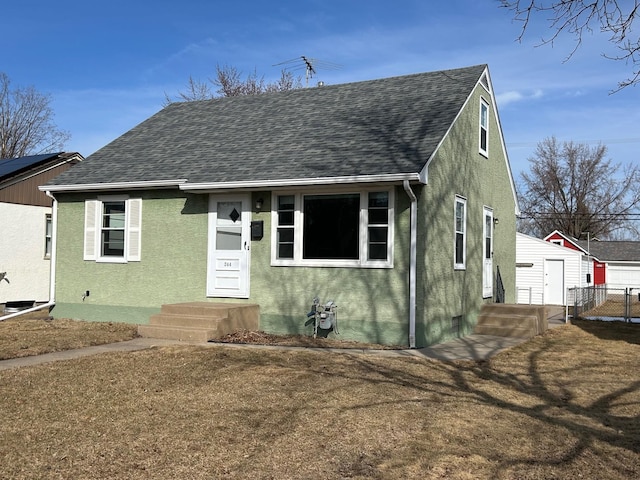 bungalow featuring stucco siding, fence, and a shingled roof