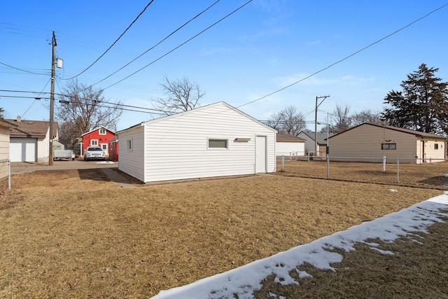 exterior space featuring an outbuilding and fence