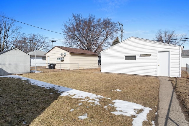 view of yard with an outdoor structure and fence