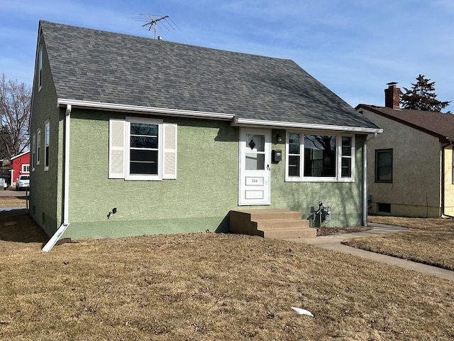 view of front of house featuring stucco siding, roof with shingles, and entry steps