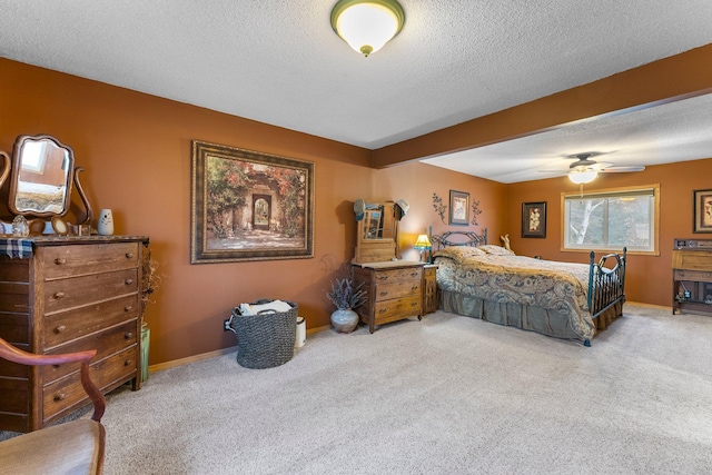 bedroom with baseboards, carpet, and a textured ceiling