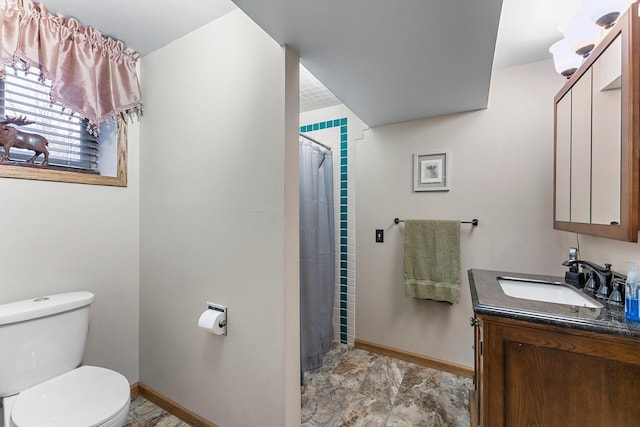 bathroom featuring vanity, curtained shower, toilet, and baseboards