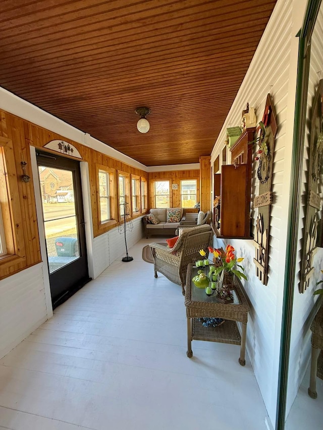 sunroom featuring wood ceiling