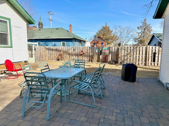 view of patio / terrace featuring outdoor dining space and fence