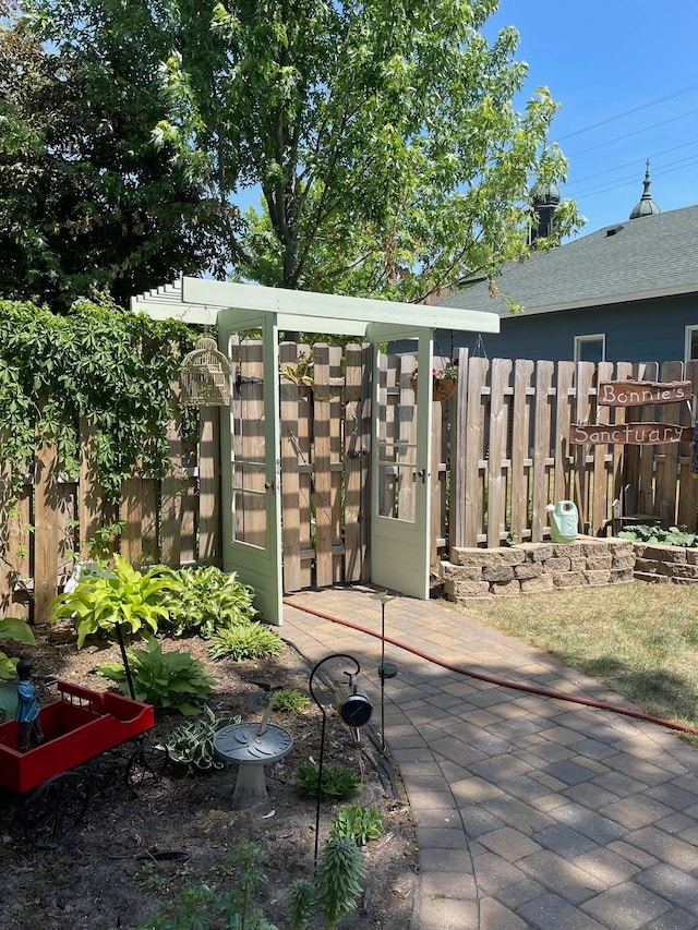 view of patio featuring fence